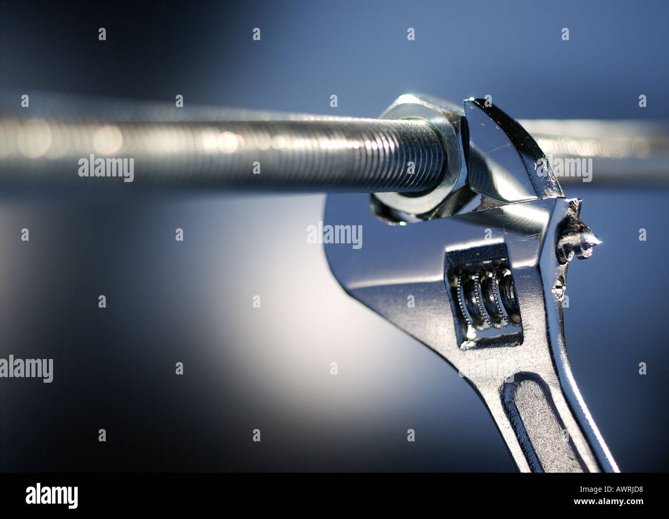 Wrench locked onto nut, closeup Stock Photo Alamy