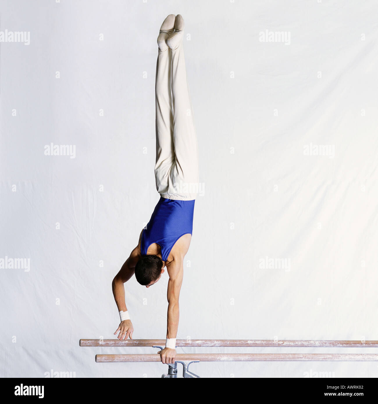 Male gymnast performing routine on parallel bars Stock Photo Alamy