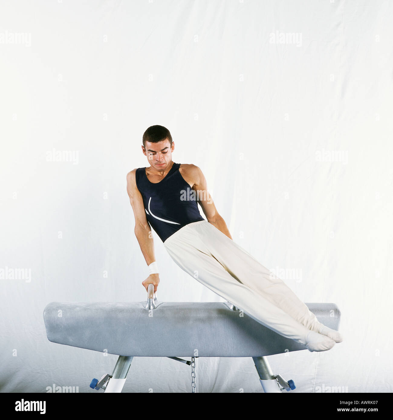 Male gymnast performing routine on pommel horse Stock Photo Alamy