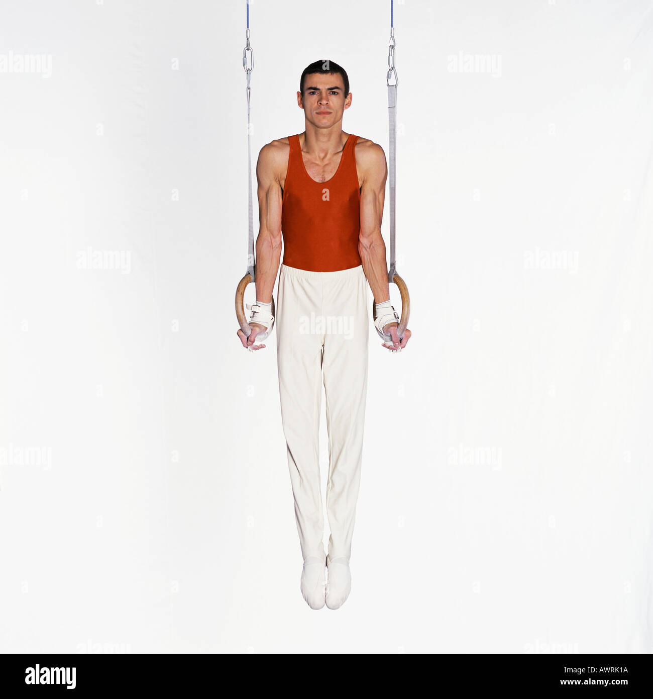Male gymnast performing on rings hires stock photography and images