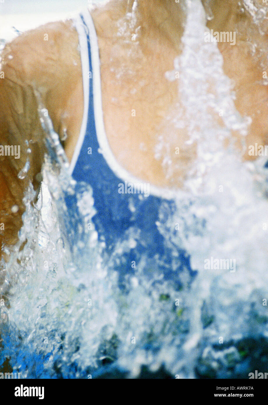 Female swimmer emerging from water, close-up Stock Photo