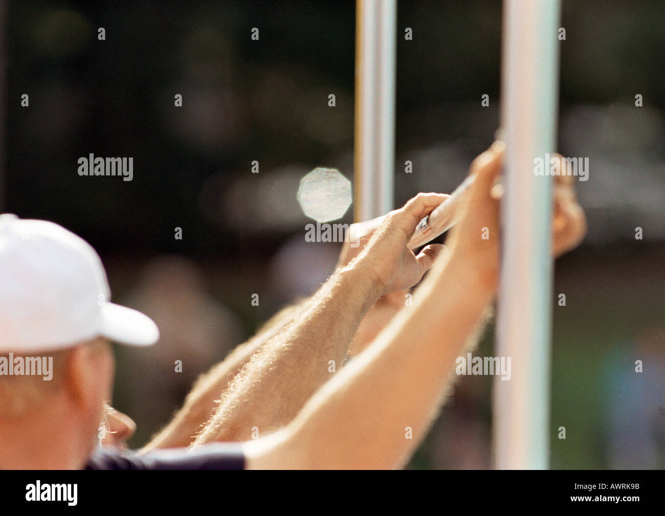 Men setting high jump crossbar Stock Photo Alamy