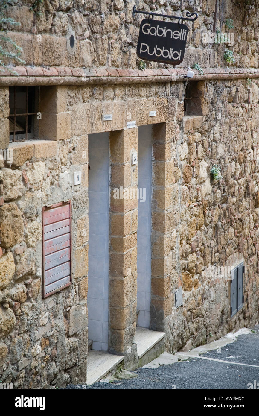 Public restroom sign over entrances Pienza Tuscany Italy Stock Photo ...