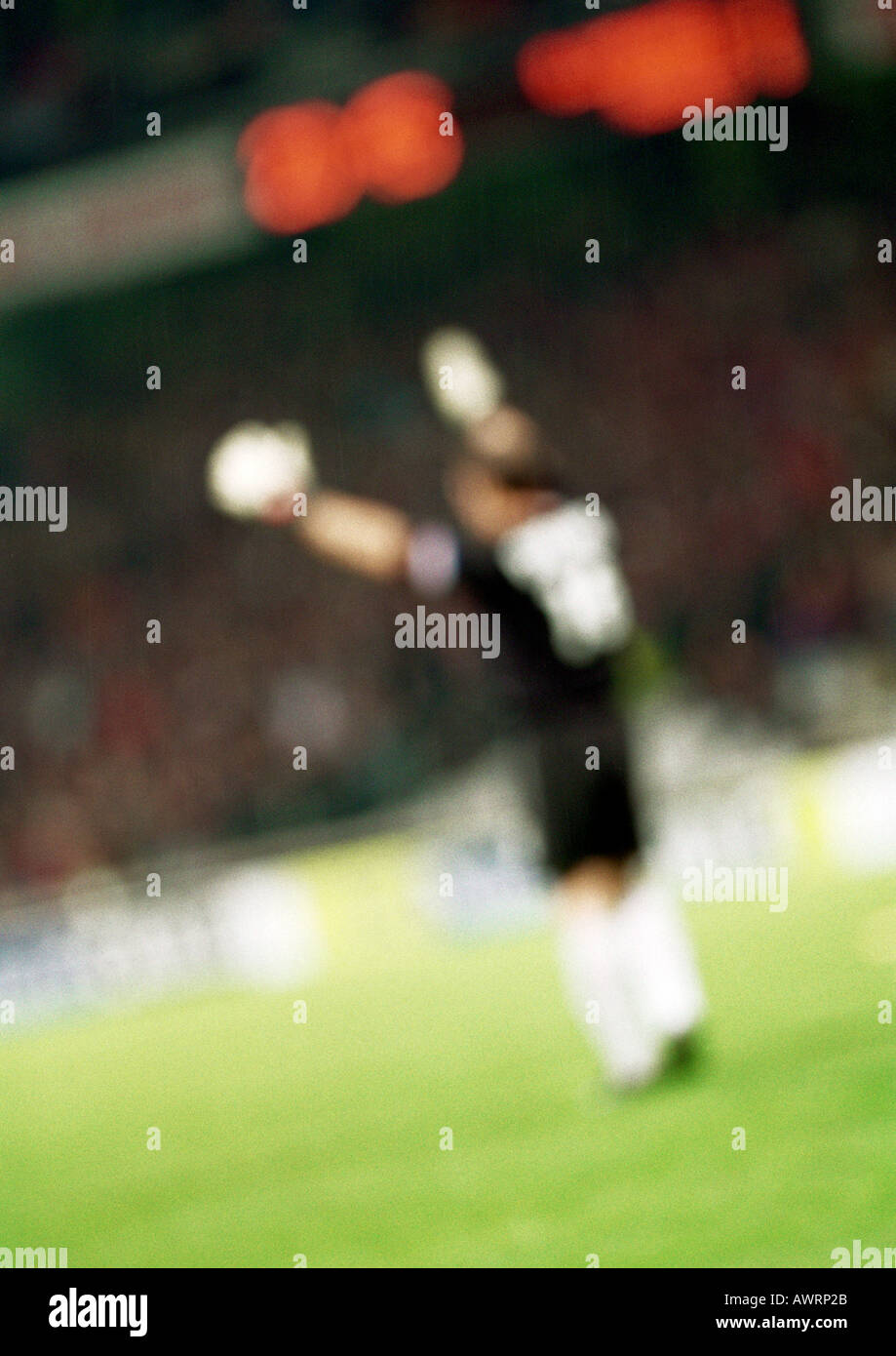 Goal keeper, side view, blurred Stock Photo - Alamy