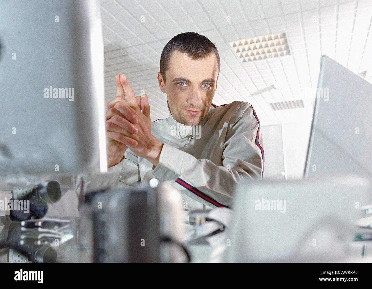 Man at desk looking into camera, portrait Stock Photo