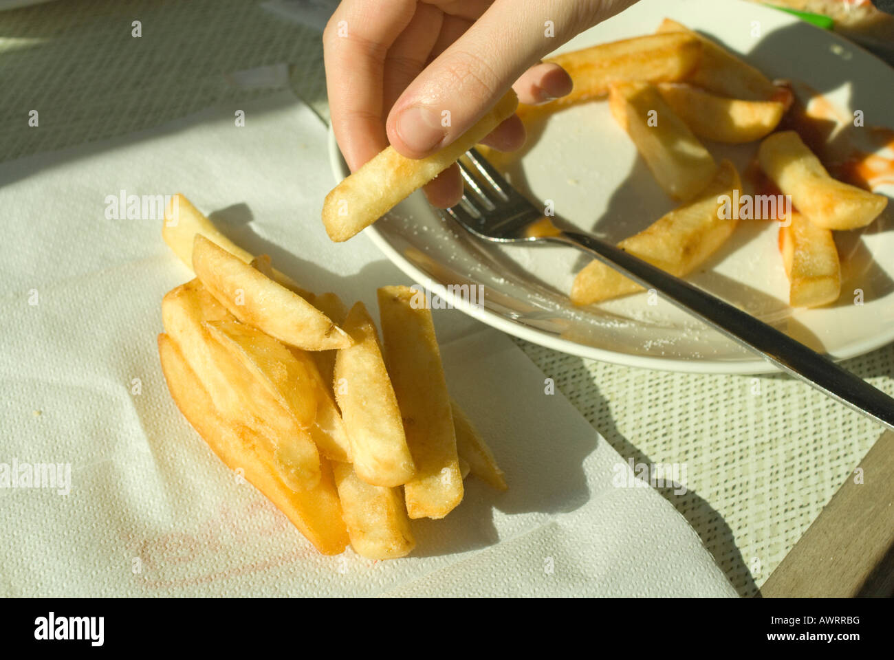 Chips on a napkin at a motorway service station Stock Photo Alamy