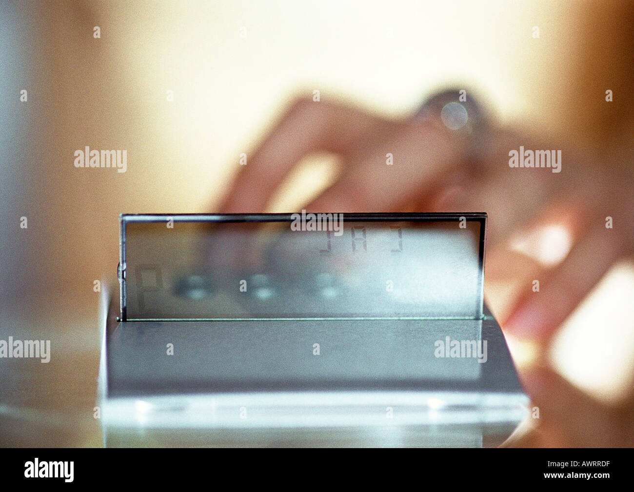 Hand on calculator, close-up, blurred Stock Photo