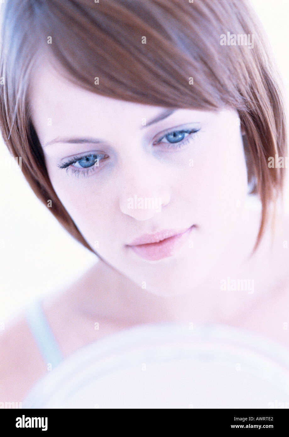 Woman's face, looking down, close-up Stock Photo