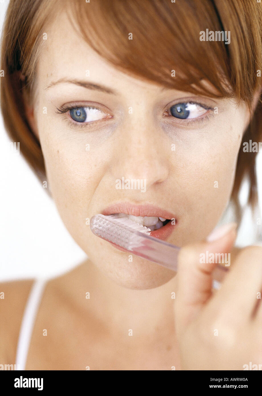 Woman brushing teeth, close-up Stock Photo
