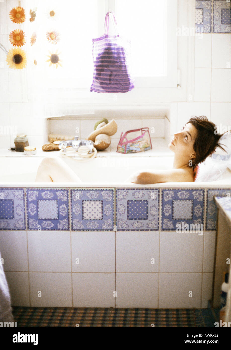 Woman in bathtub, looking up, side view Stock Photo Alamy