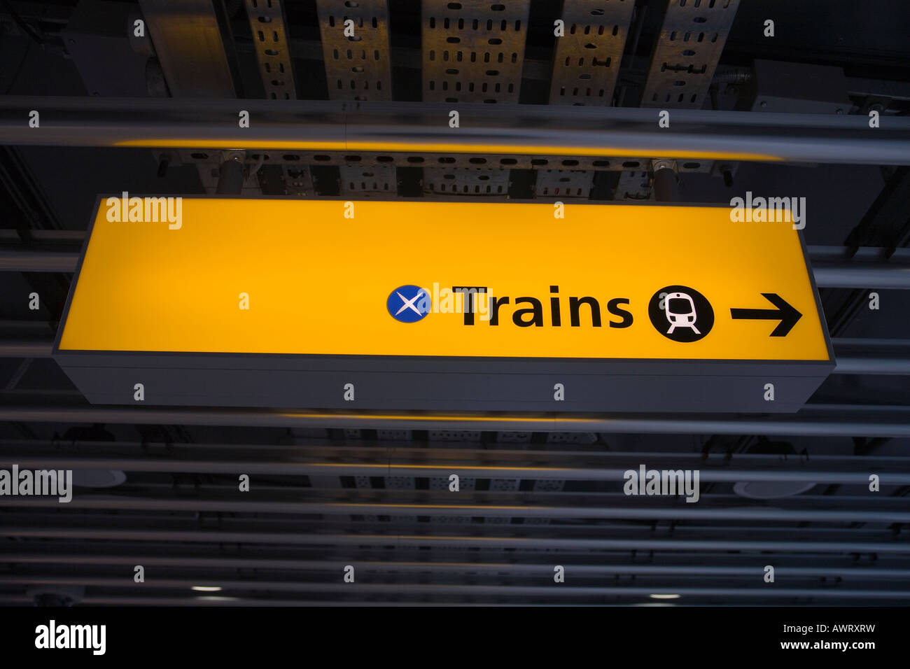 Direction sign to the train station at London Heathrow Airport Terminal 5 Stock Photo