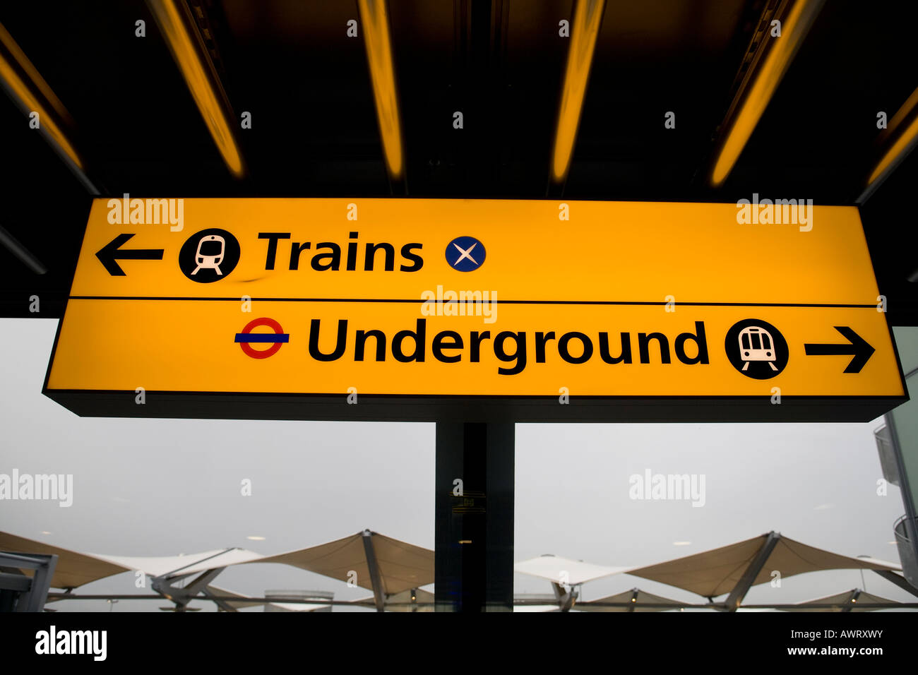 Information display showing direction to the Train and Underground stations at London Heathrow Airport terminal 5 Stock Photo