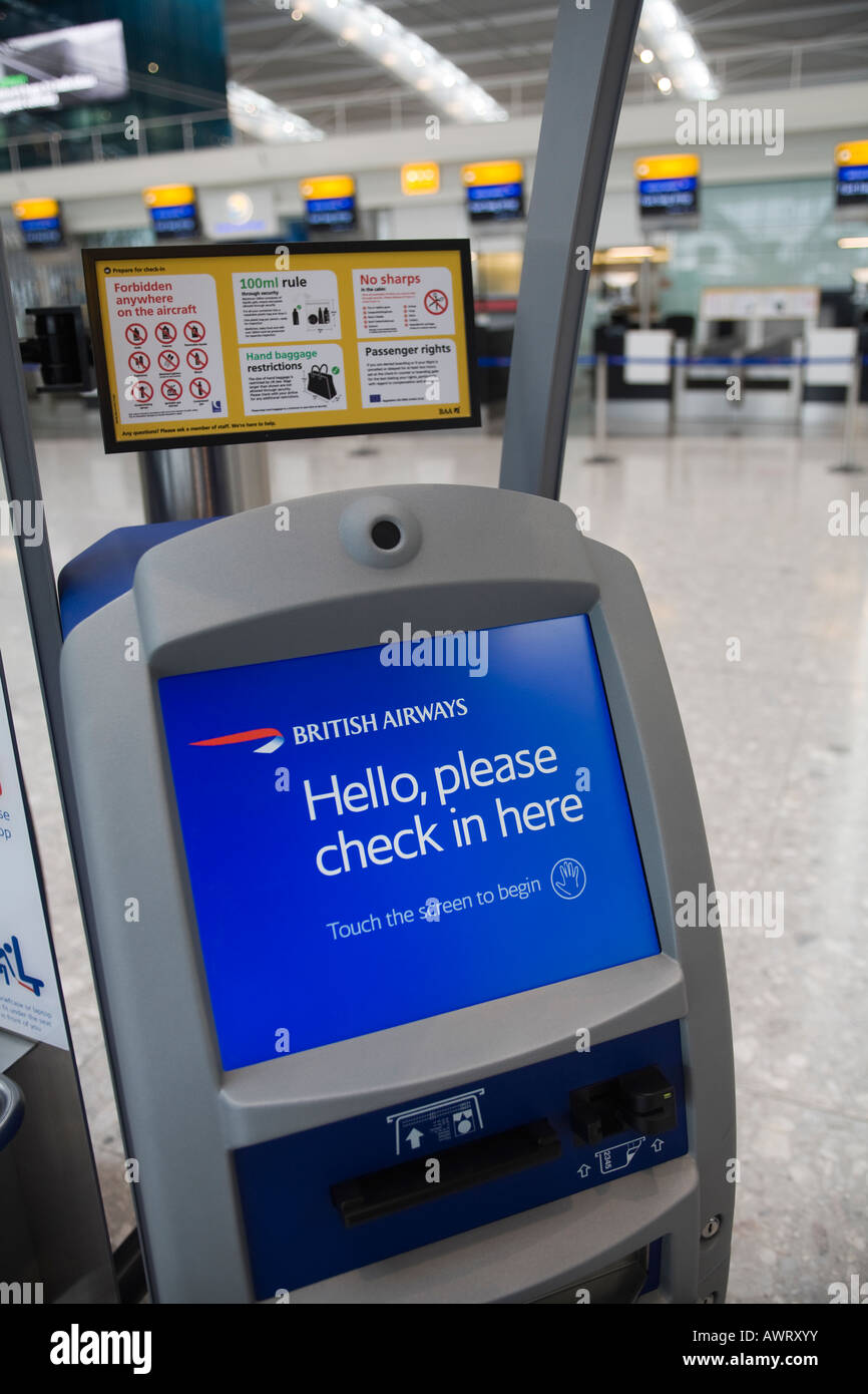 An automated British Airways check in desk with information screen Stock Photo