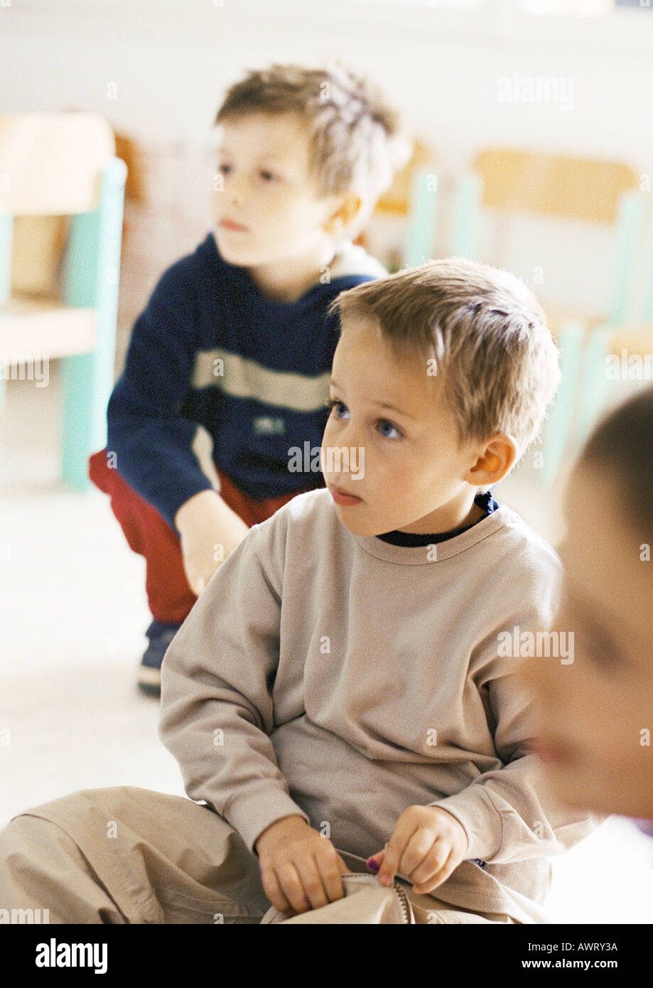 Children looking attentive in classroom Stock Photo