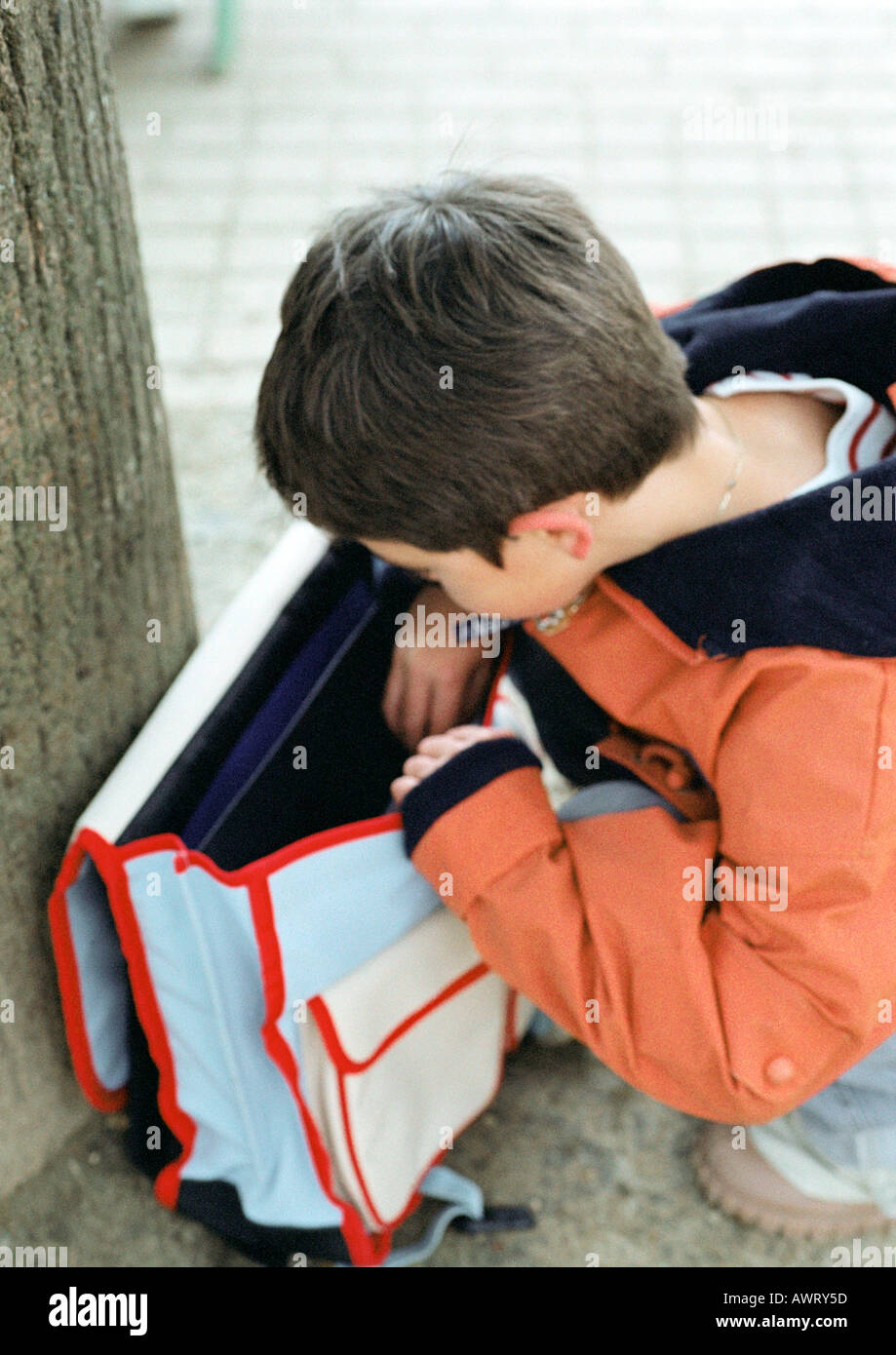 Child looking into backpack Stock Photo Alamy