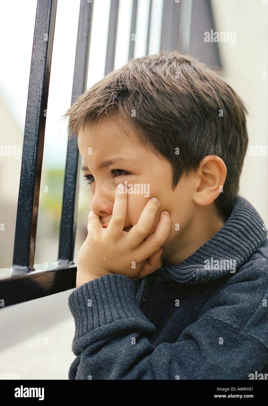 Child With Hand Under Chin, Close-up Stock Photo - Alamy