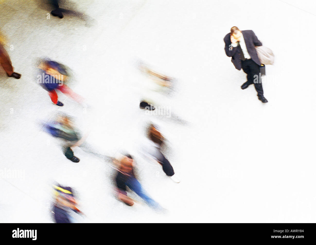 Businessman in crowd, elevated view, blurred Stock Photo