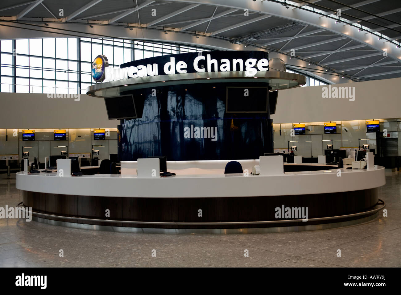 A Thomas Cook Bureau de Change desk at London Heathrow Airport Terminal 5 Stock Photo