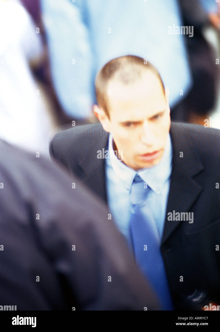 Businessman in crowd, close-up, elevated view Stock Photo