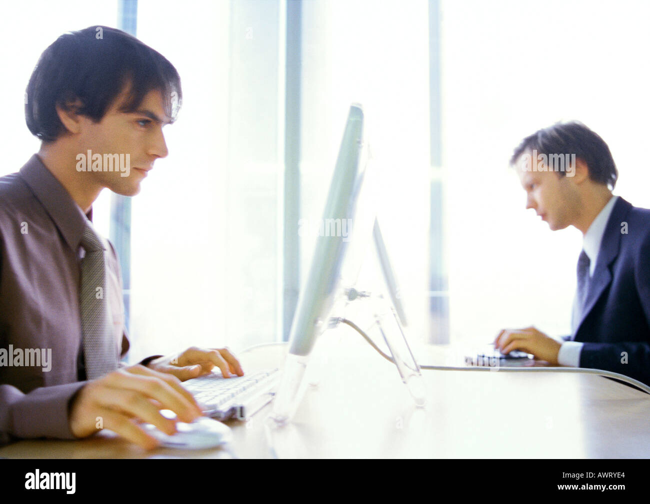 Two computers facing hi-res stock photography and images - Alamy