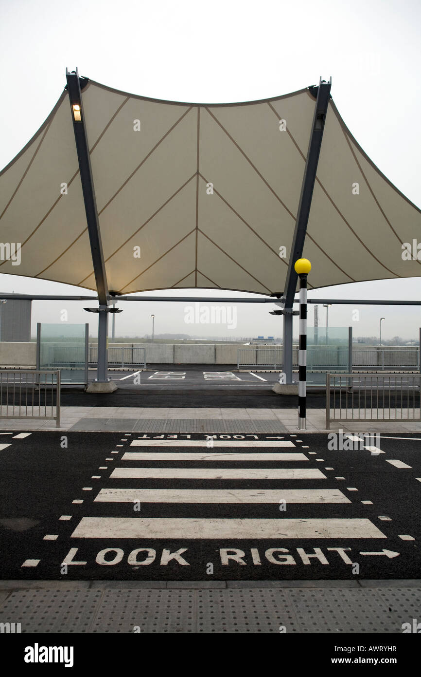A pedestrian crossing point outside London Heathrow Airport Terminal 5 Stock Photo
