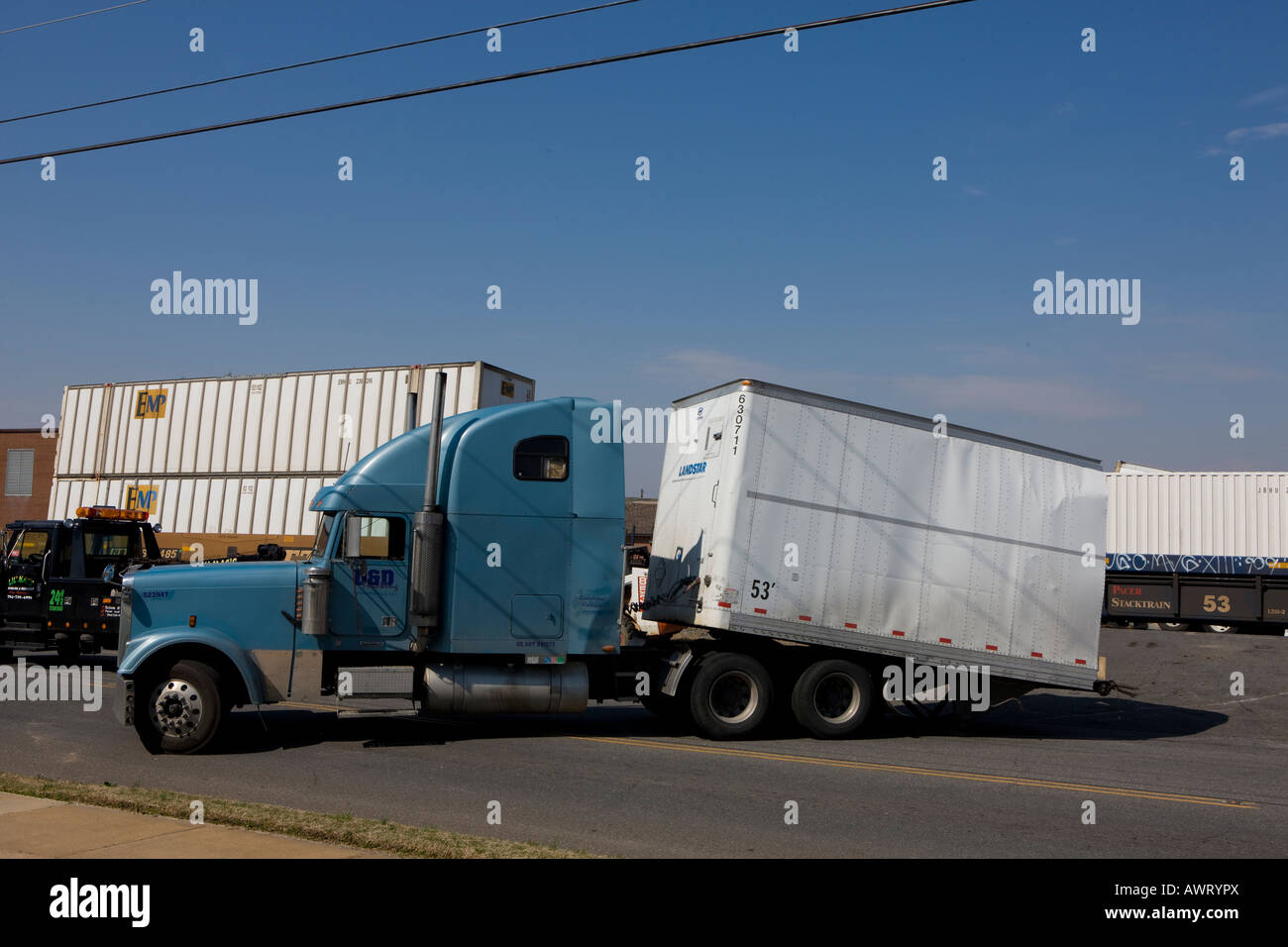 A tractor trailer was hit by an freight train at a railroad