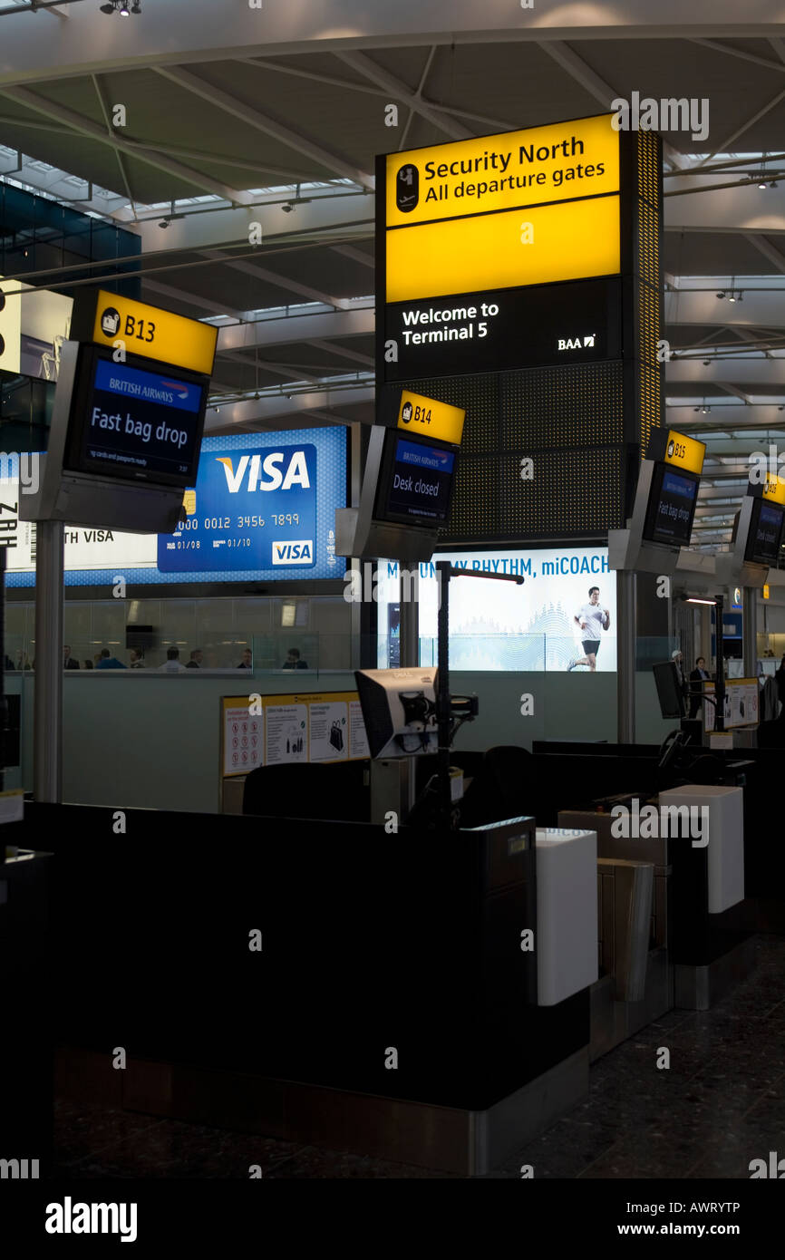Fast bag drop desk and welcome sign at London Heathrow Airport Terminal 5 Stock Photo