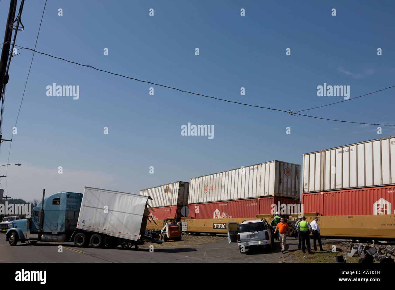 A tractor trailer was hit by an freight train at a railroad