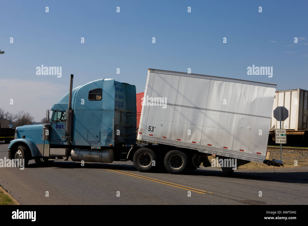 A tractor trailer was hit by an freight train at a railroad