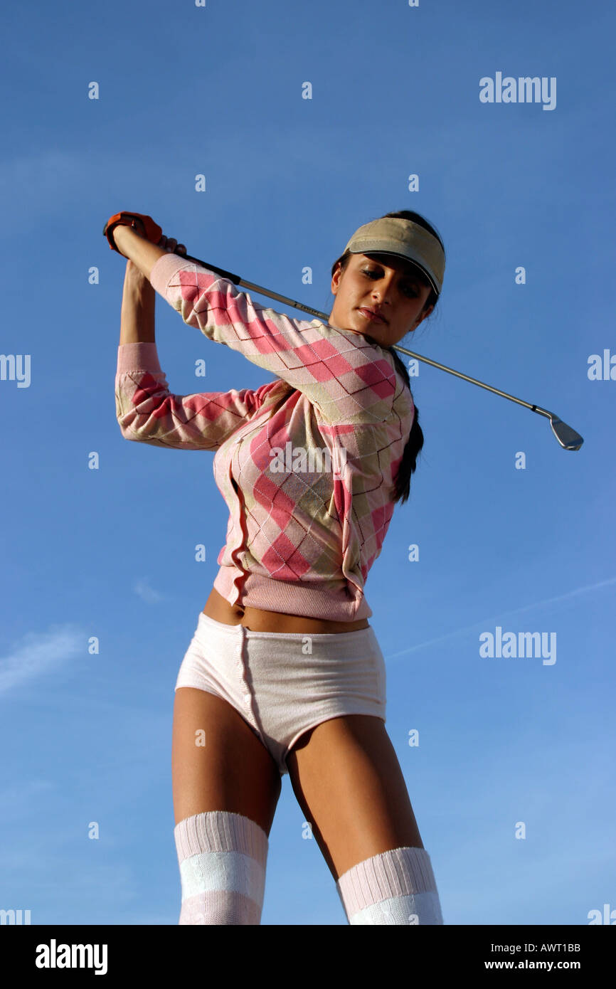 GIRL IN FUNKY TRENDY GOLF OUTFIT PLAYING GOLF Stock Photo - Alamy