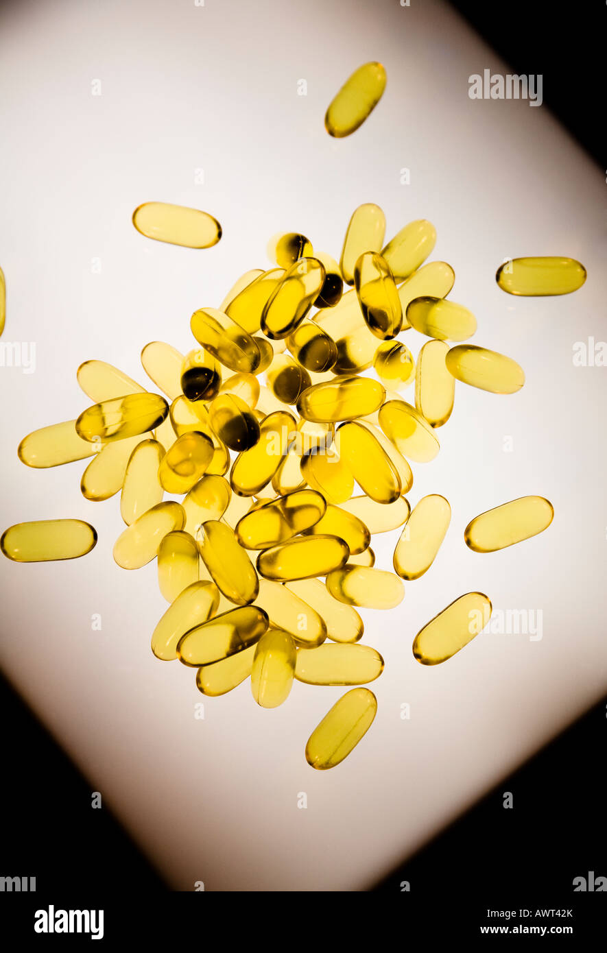 Omega-3 vitamin tablets lit from below Stock Photo