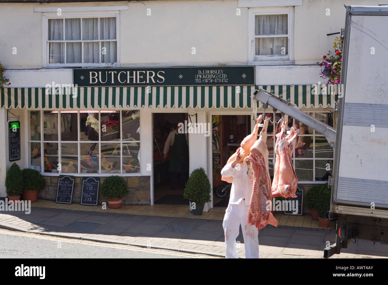 Delivering fresh pig carcasses to a butcher in Pickering, North Yorkshire UK Stock Photo