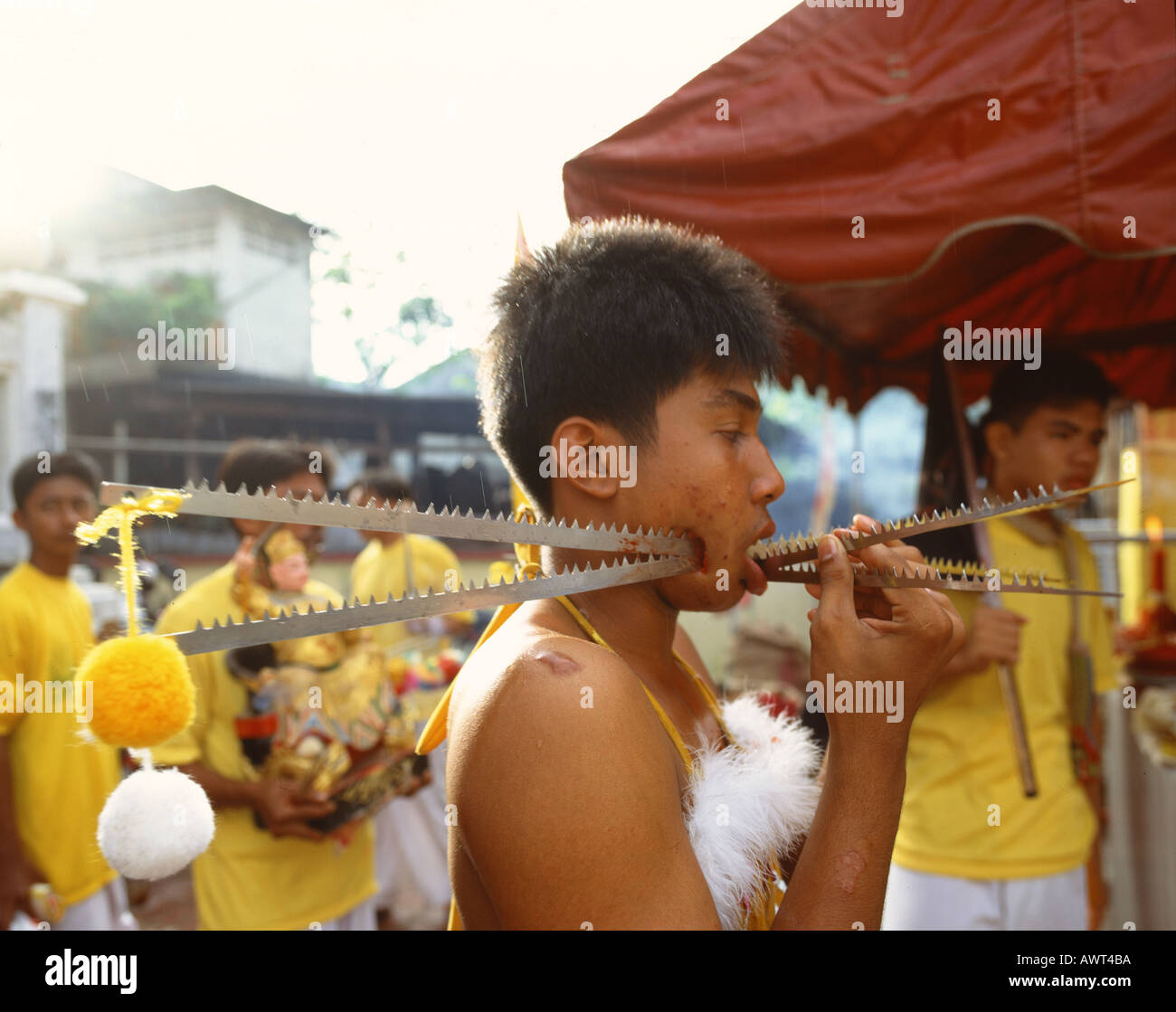 VEGETARIAN FESTIVAL PHUKET THAILAND TORTURE SELF MUTILATION Stock Photo