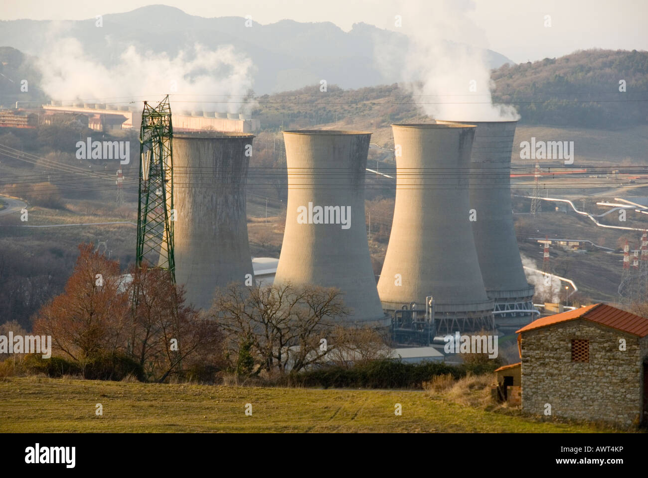 Cooling towers of the Larderello Geothermal Energy power plant run by Italian Energy company Enel Stock Photo