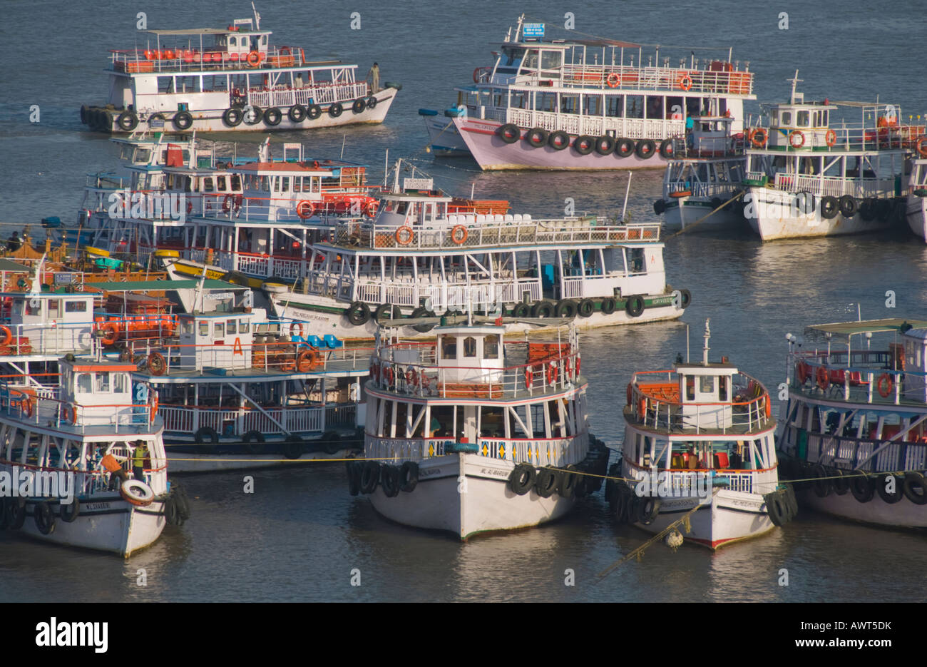 Ferry boats tied up in the harbor off the coast of Mumbai, India Stock Photo