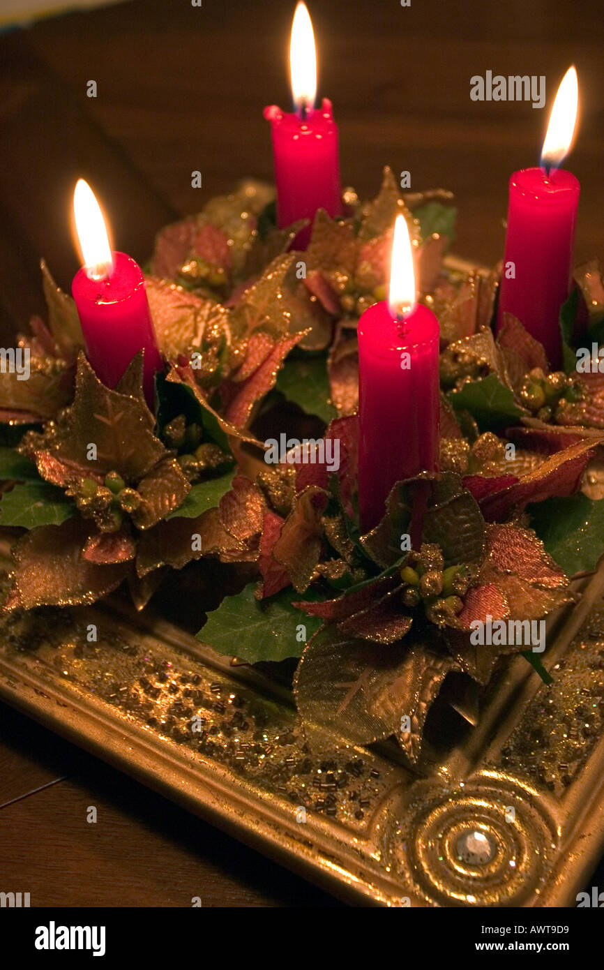 red votive candles burning in a french table for christmas diner Stock Photo