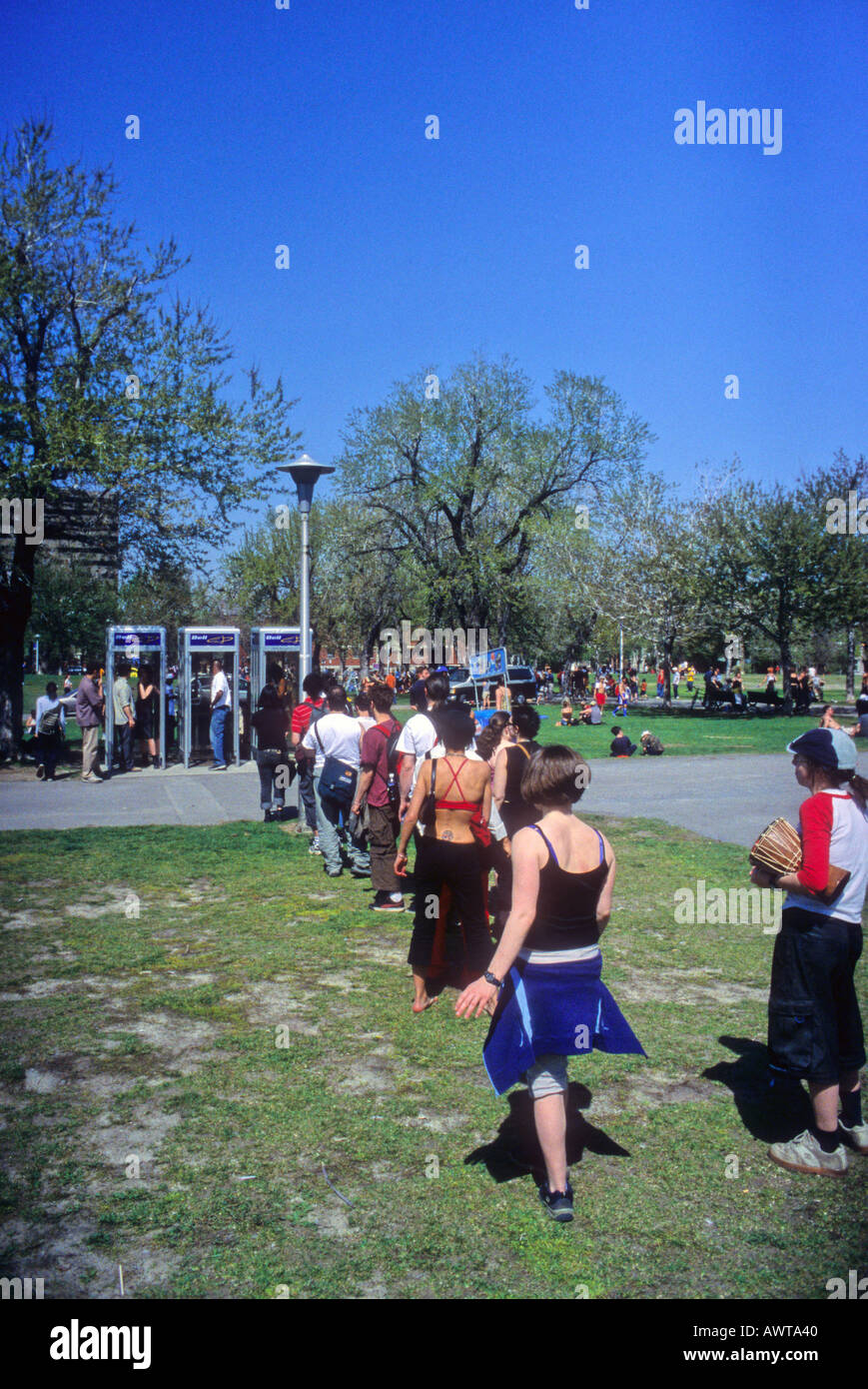 Lineup for public phone Stock Photo