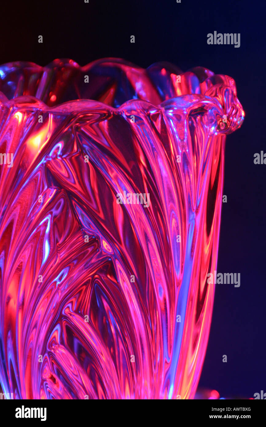 A Glass Vase Reflecting Blue And Pink Party Lights Stock Photo