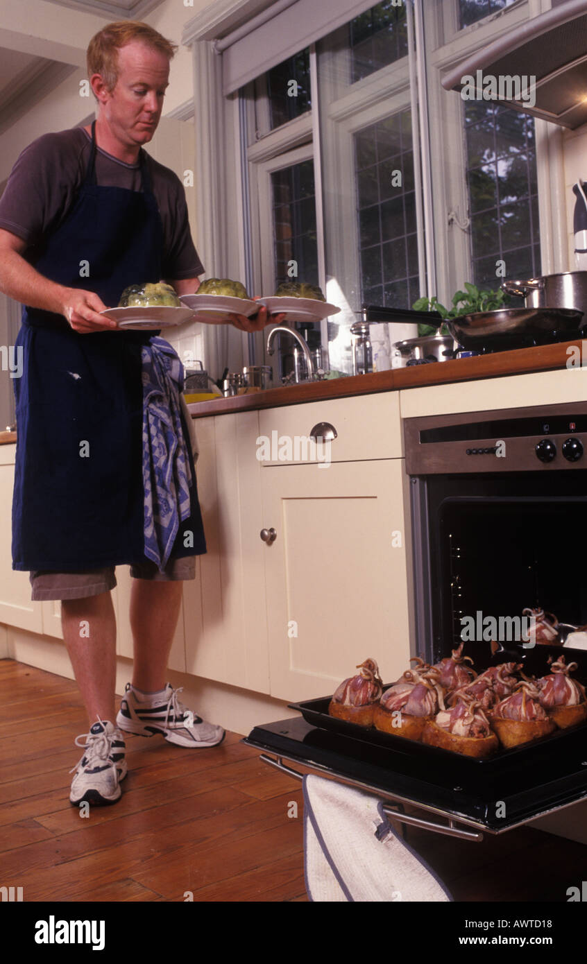 Man Cook Prepares A Dinner Party Meal For Friends And Family Homer Sykes Stock Photo Alamy