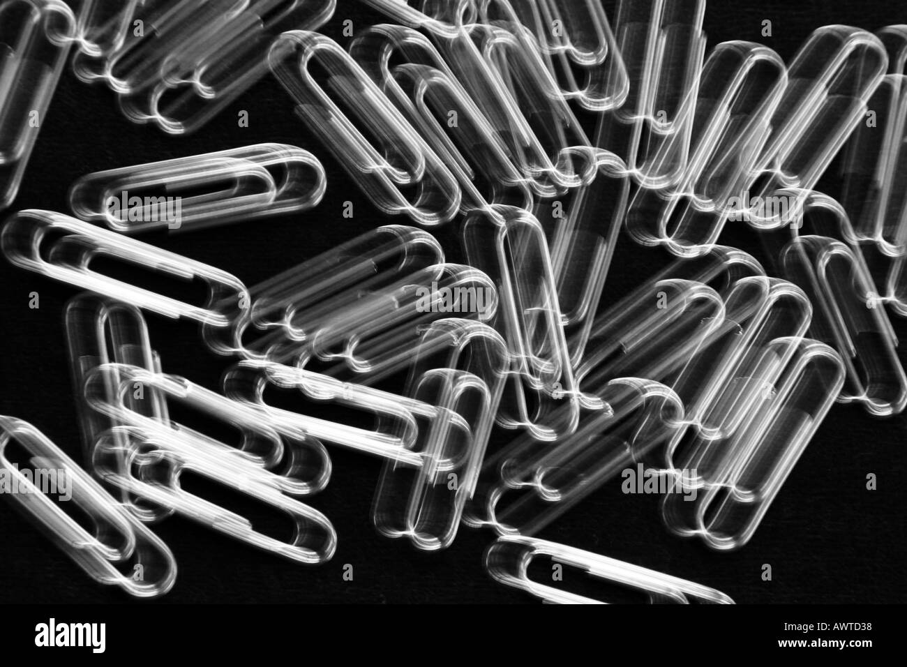 Blurred silver paperclips Stock Photo
