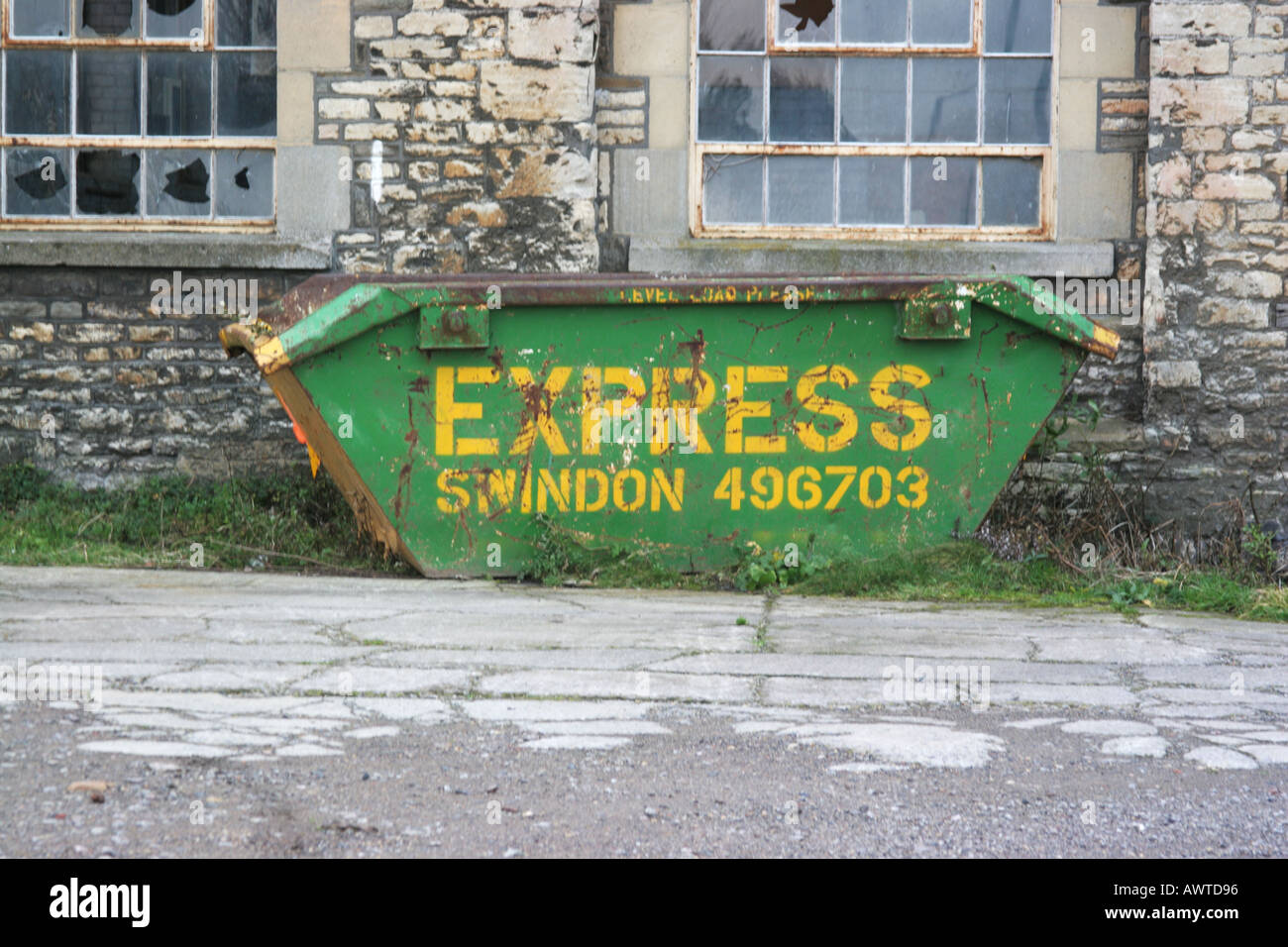 Abandoned building swindon railway works wiltshire dumpster skip Stock Photo