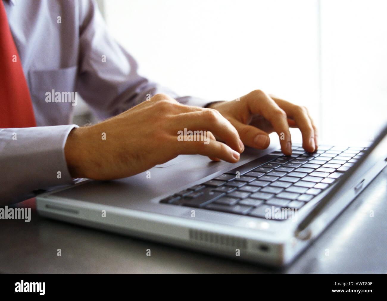 Man's hands on keyboard of laptop computer Stock Photo - Alamy