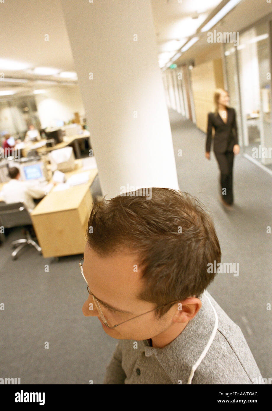 Businessman walking through office, view from above. Stock Photo