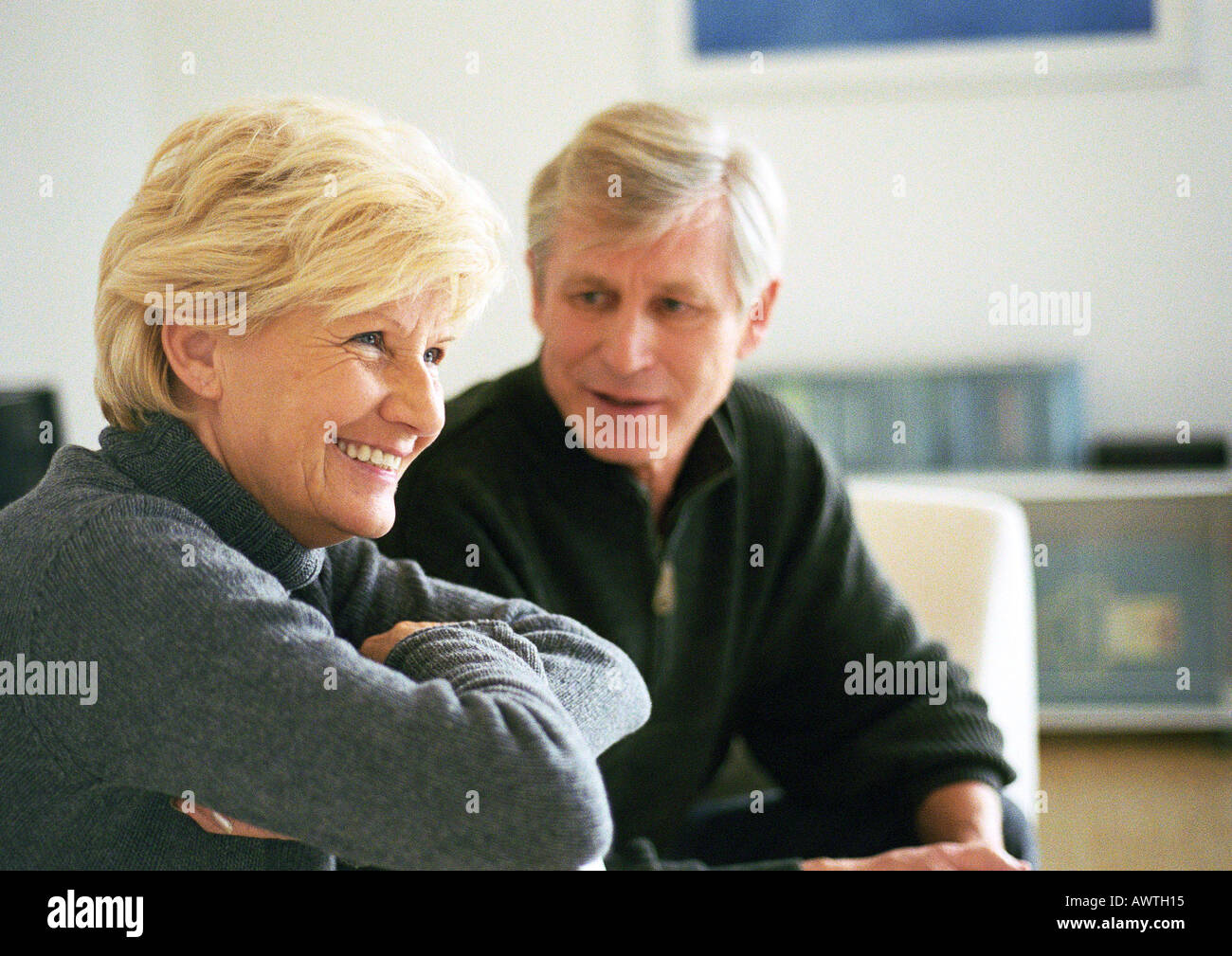 Woman sitting across couch hi-res stock photography and images - Alamy