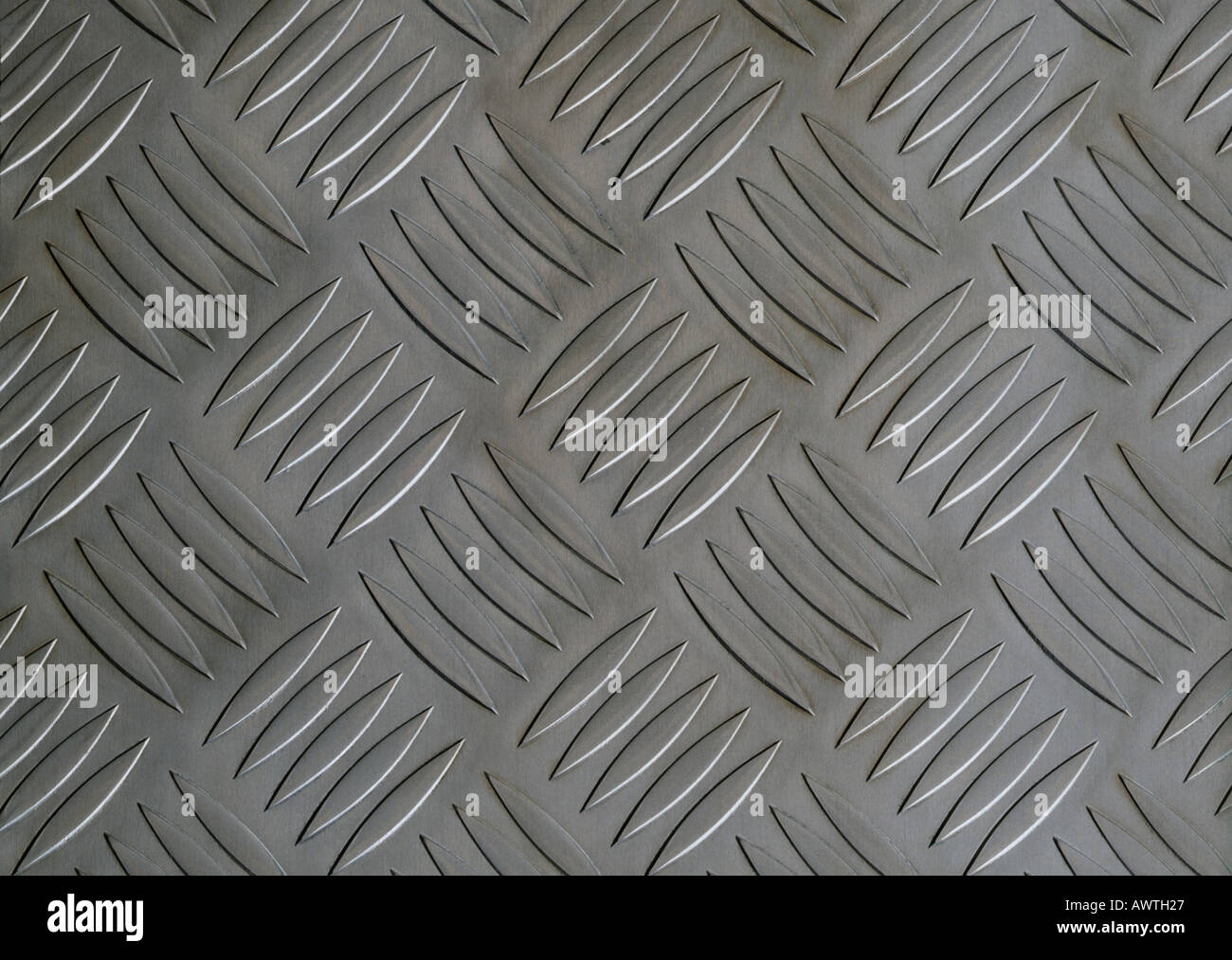 Repetitive pattern on metal plate, close-up, full frame Stock Photo