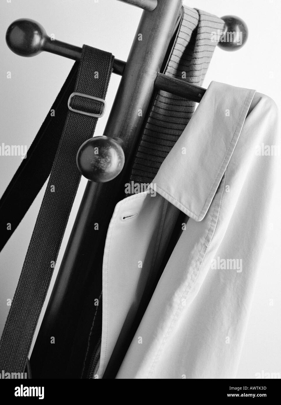 Jacket, bag and scarf on coat rack, close-up Stock Photo