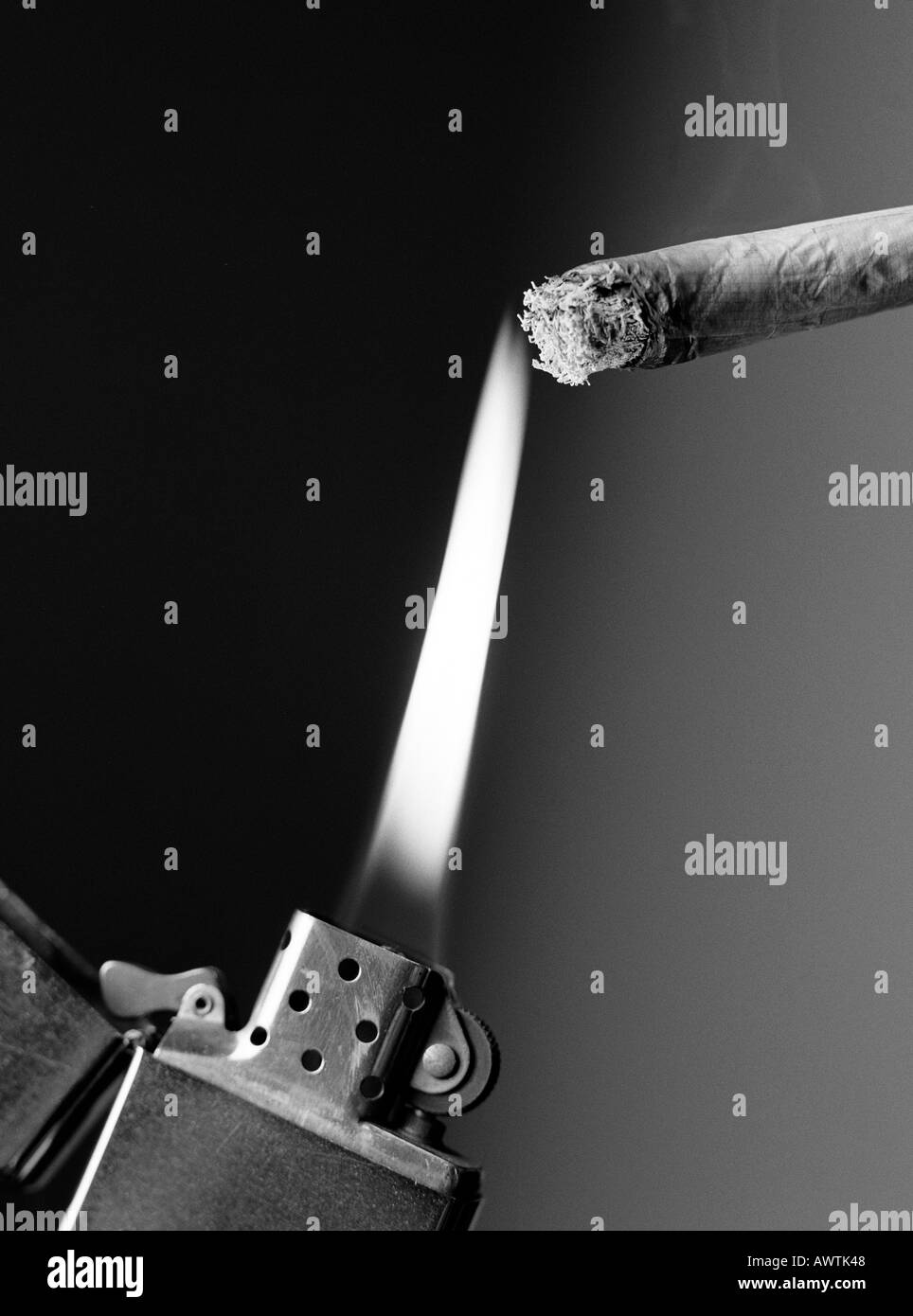 Lighter lighting cigarette, close-up Stock Photo