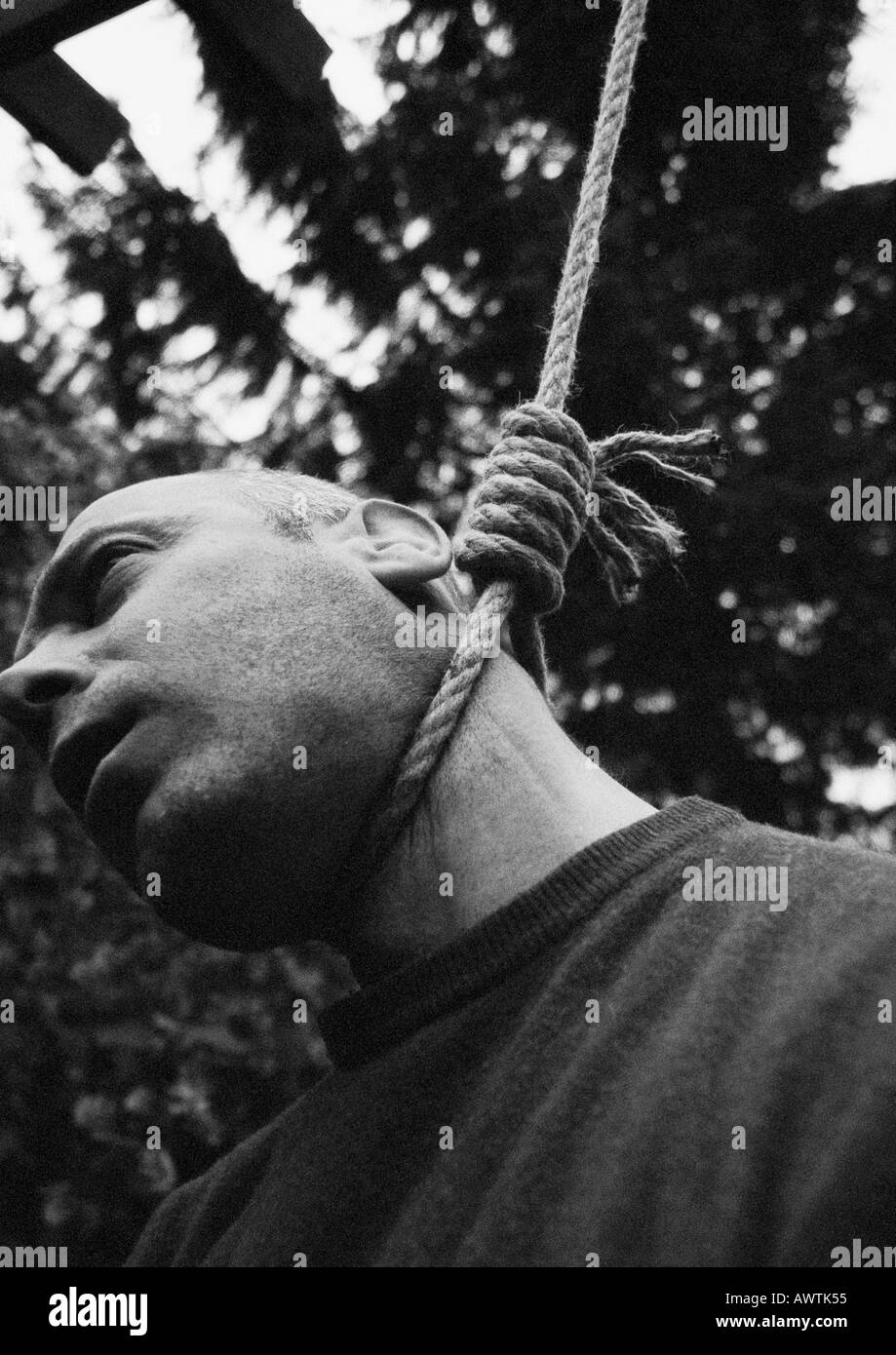 Hanged man, close-up, low-angle shot, b&w Stock Photo