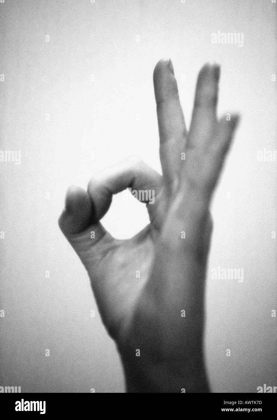 Hand forming ok sign, close-up, b&w Stock Photo
