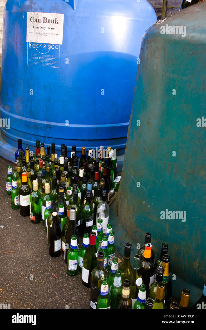 Recycling wine bottles can bank in a large container. Recycling centre